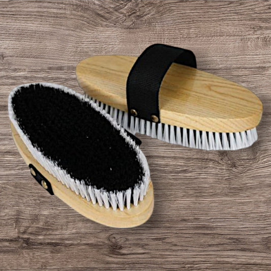 Soft bristles on an oval base with hand strap