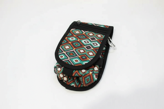 Clarabeths geometric saddle pouch featuring a vibrant multi-colored diamond pattern, zipper closure, and carabiner.